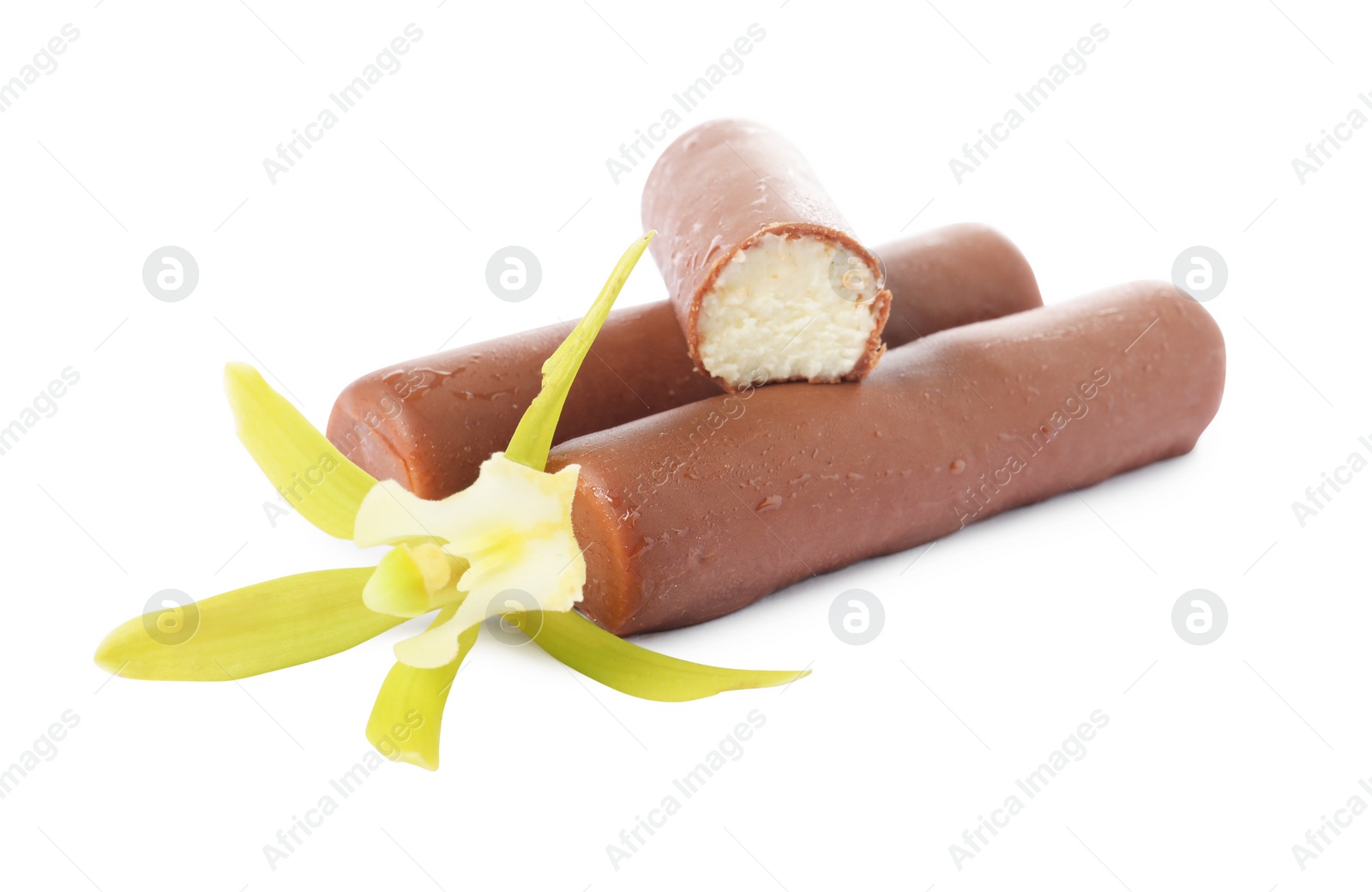 Photo of Glazed curd cheese bars and vanilla flower isolated on white