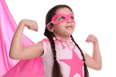 Cute little girl in superhero suit on white background