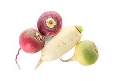 Photo of Different ripe turnips on white background, top view