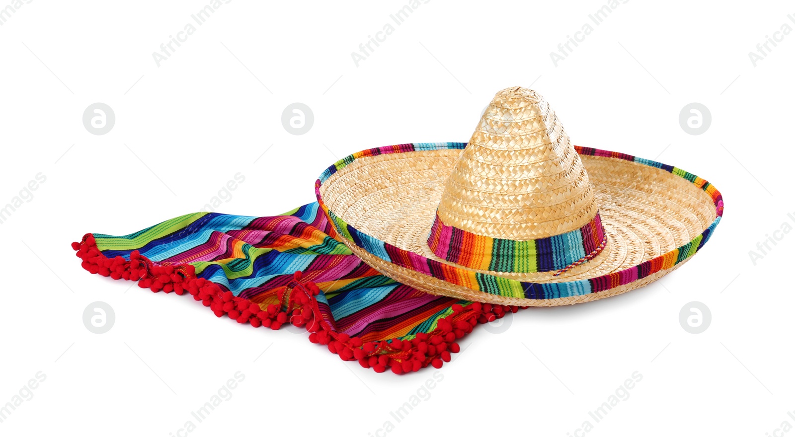 Photo of Mexican sombrero hat and colorful poncho isolated on white