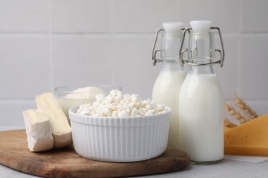 Photo of Different fresh dairy products on light table