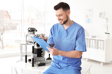 Photo of Portrait of smiling ophthalmologist in clinic