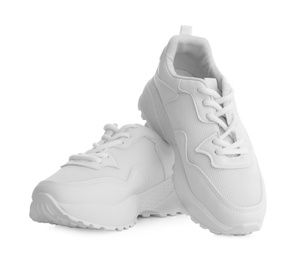 Photo of Stylish sneakers on white background. Trendy footwear