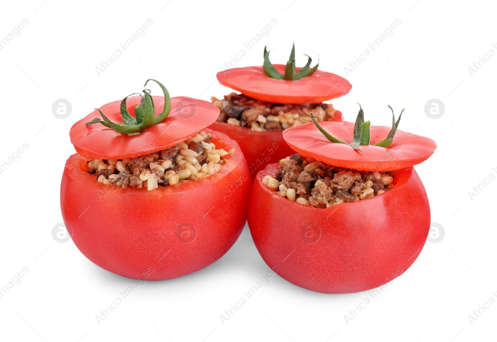 Photo of Delicious stuffed tomatoes with minced beef, bulgur and mushrooms isolated on white