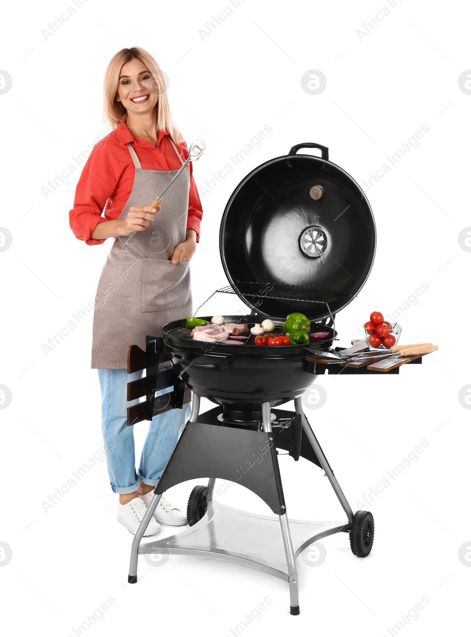 Photo of Woman in apron cooking on barbecue grill, white background