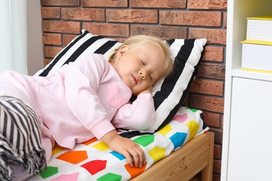 Photo of Cute little girl sleeping in bed at home