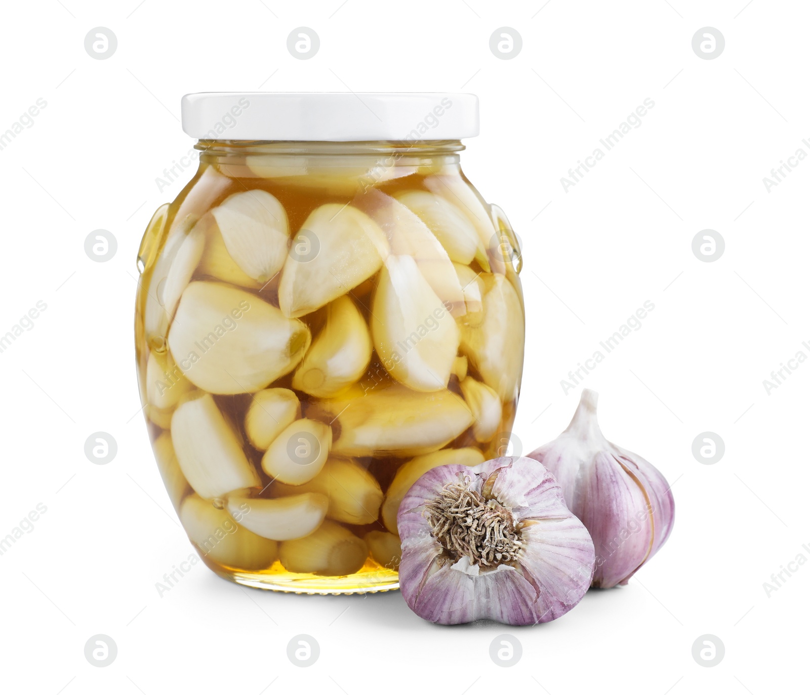 Photo of Garlic with honey in glass jar and fresh bulbs isolated on white