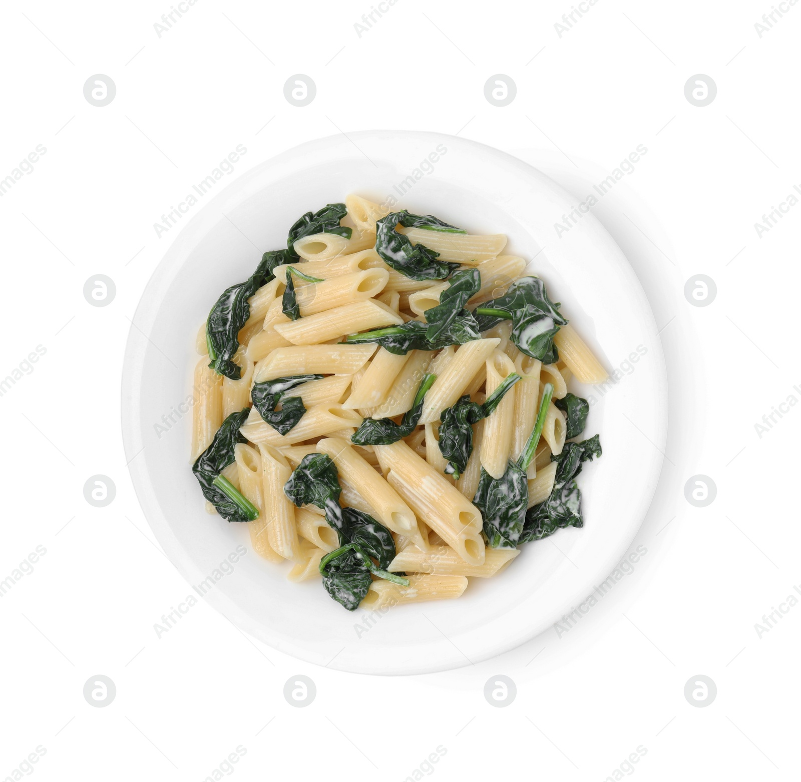 Photo of Tasty pasta with spinach and sauce isolated on white, top view