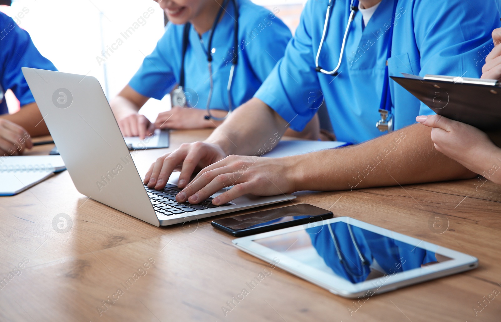 Photo of Medical students studying at table, closeup view