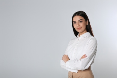 Portrait of young businesswoman on white background. Space for text