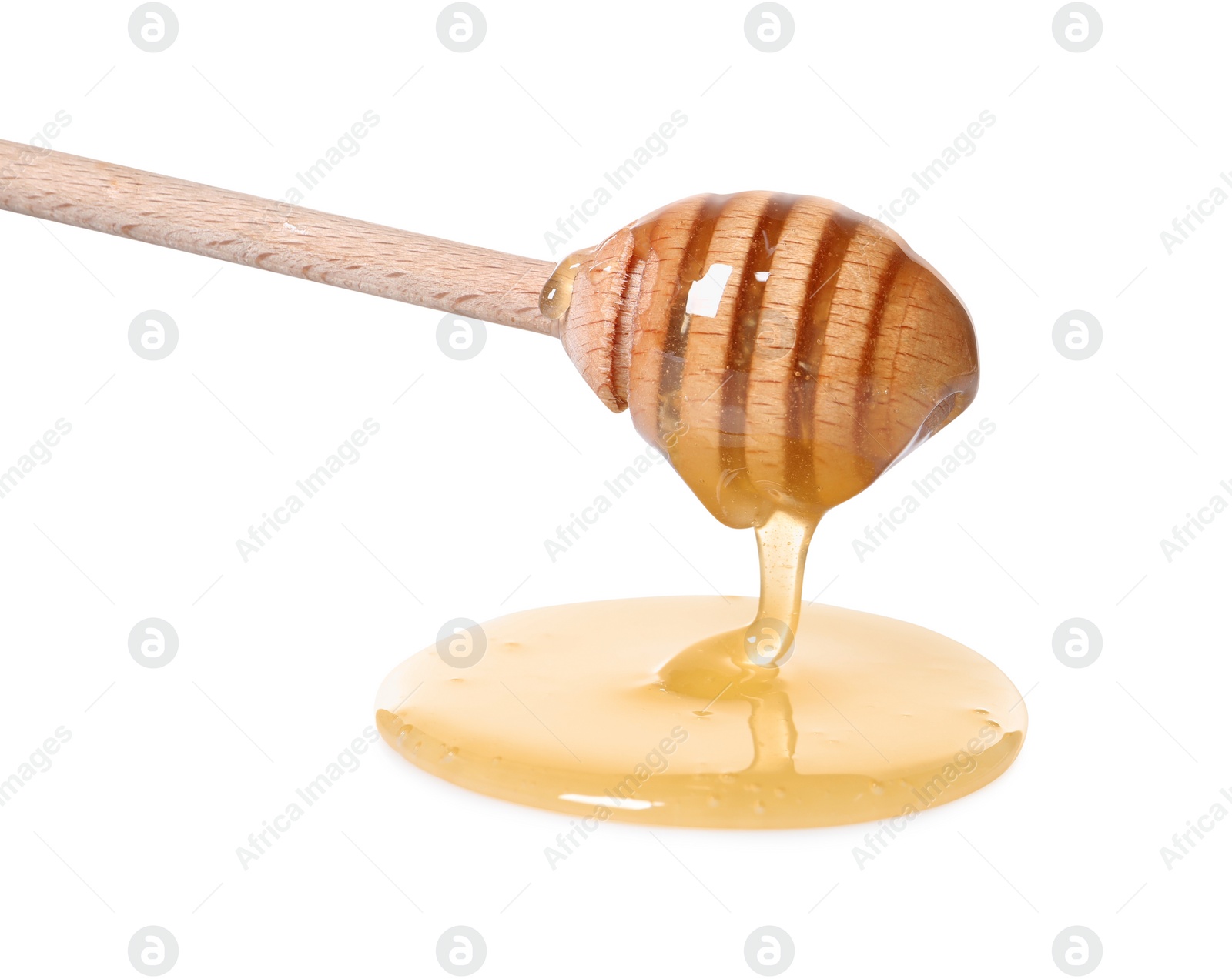 Photo of Natural honey dripping from dipper on white background