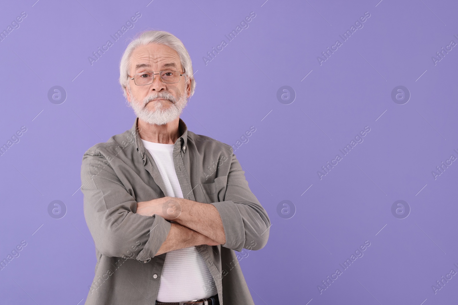 Photo of Portrait of stylish grandpa with glasses on purple background, space for text