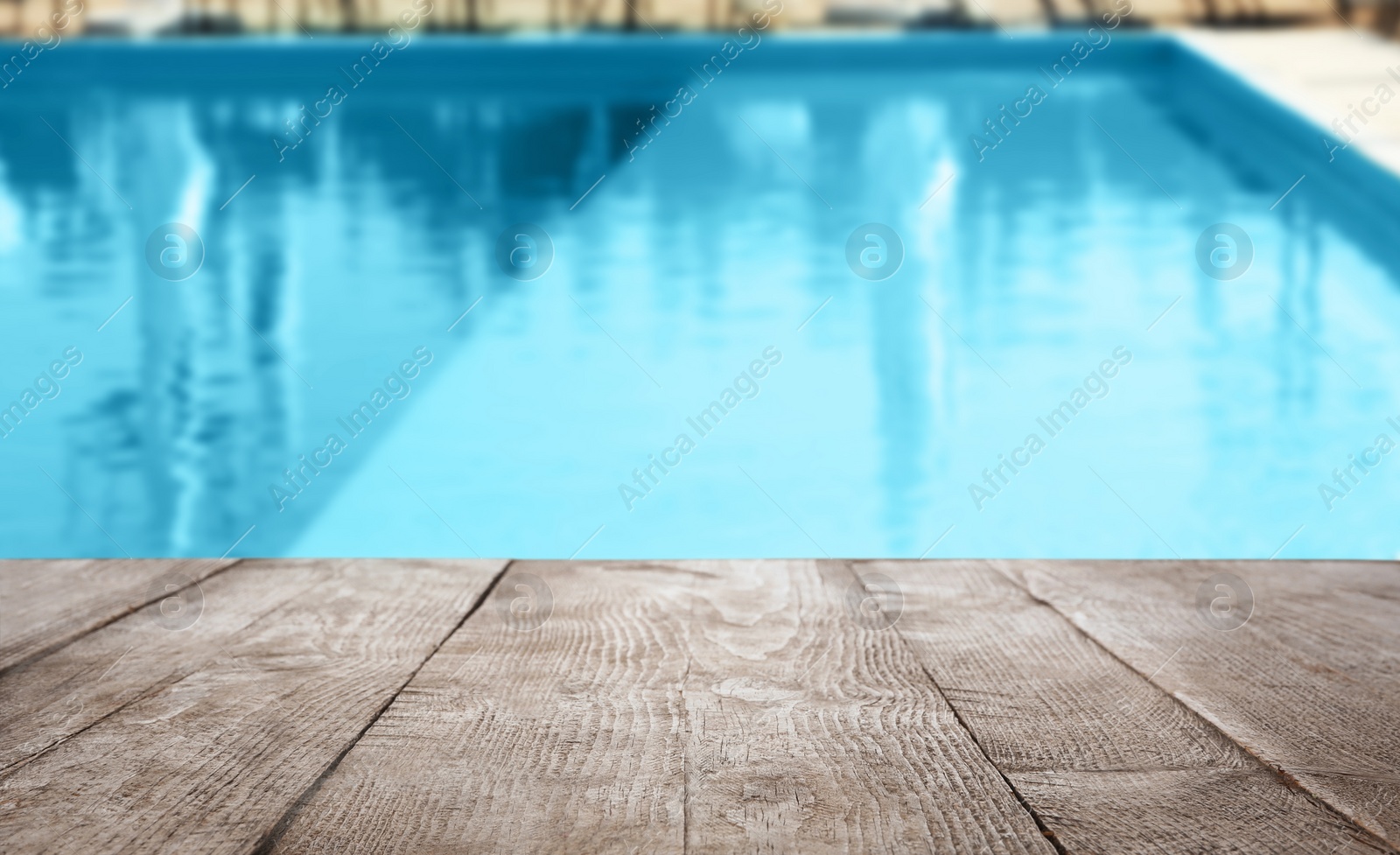 Image of Wooden deck near swimming pool outdoors on sunny day. Space for text