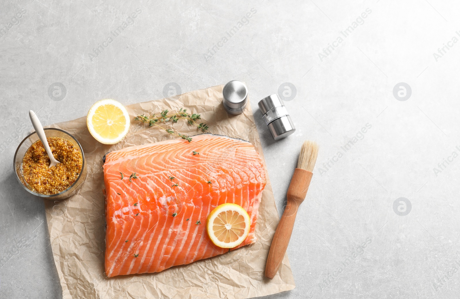 Photo of Raw salmon fillet and ingredients for marinade on table, top view