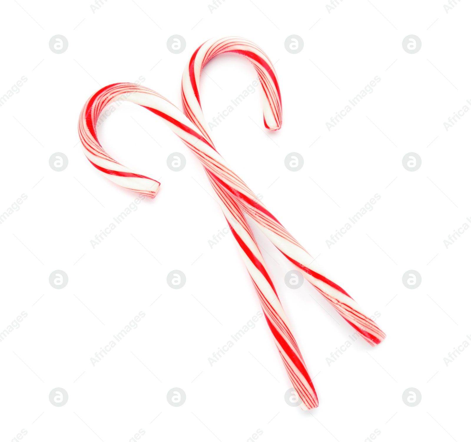 Photo of Tasty candy canes on white background. Festive treat