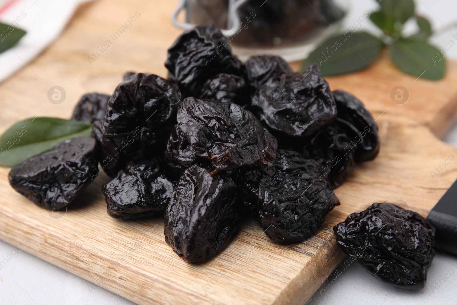 Photo of Tasty dried prunes on table, closeup view