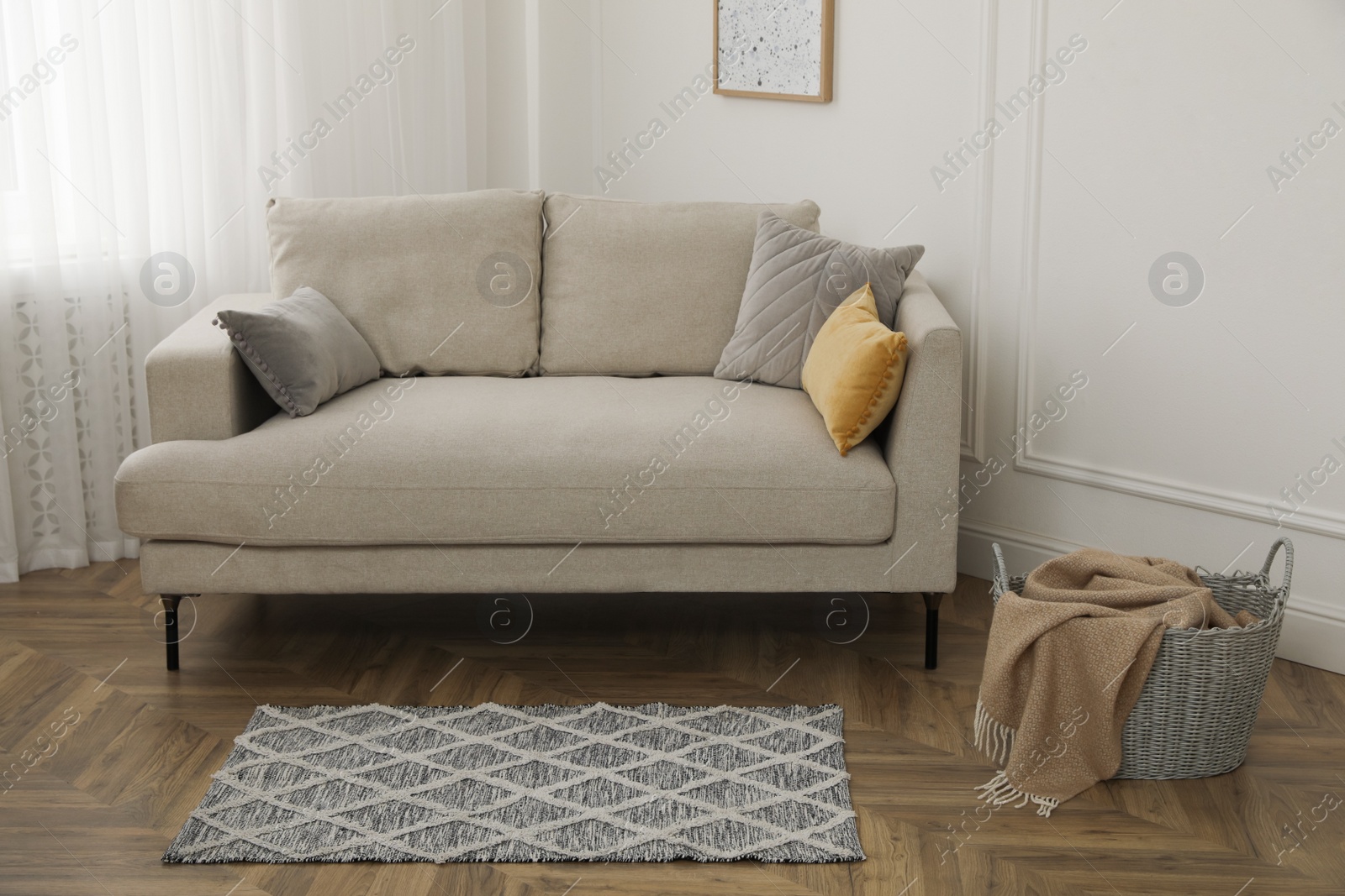 Photo of Modern living room interior with comfortable sofa and rug