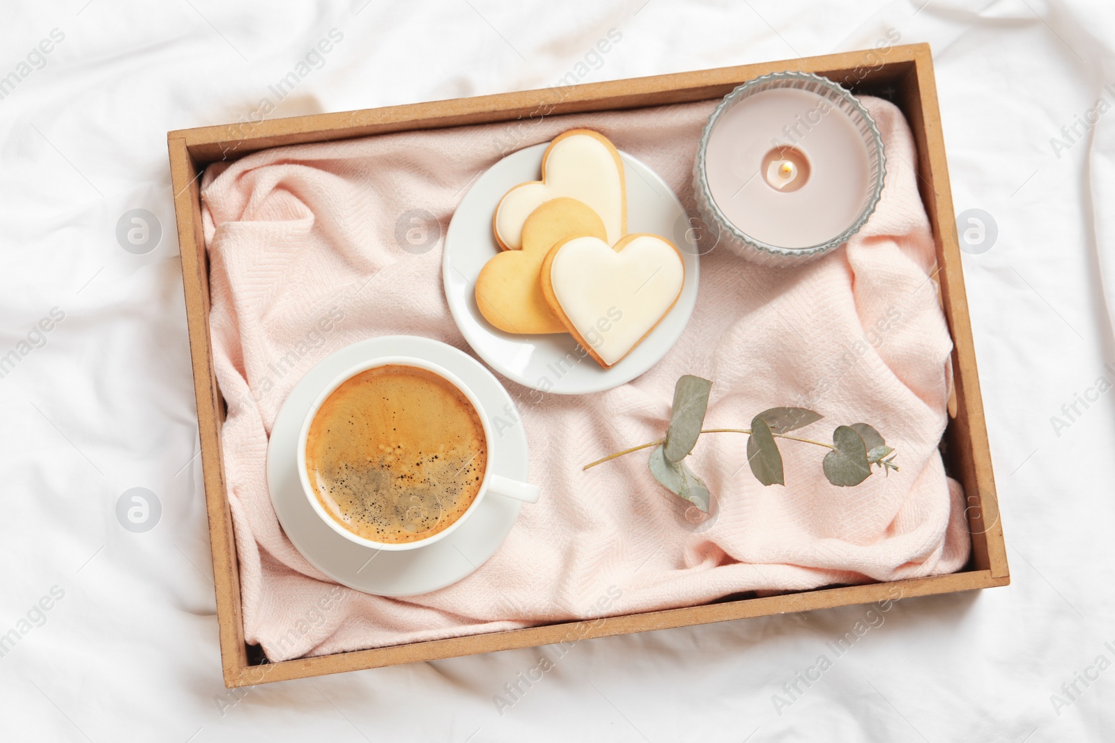 Photo of Aromatic coffee and cookies on bed, flat lay. Romantic breakfast
