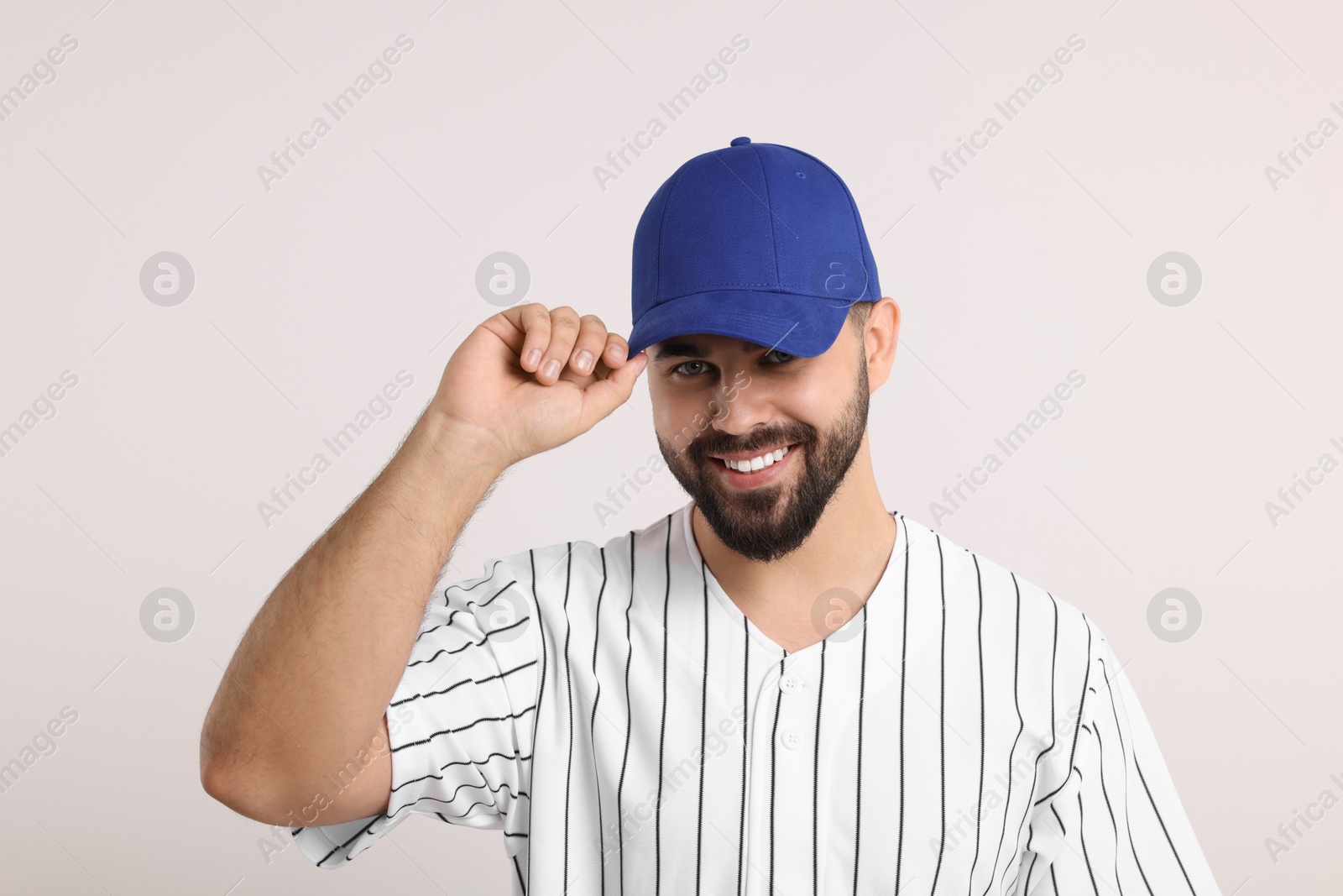 Photo of Man in stylish blue baseball cap on white background