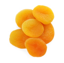 Photo of Pile of tasty apricots on white background, top view. Dried fruits