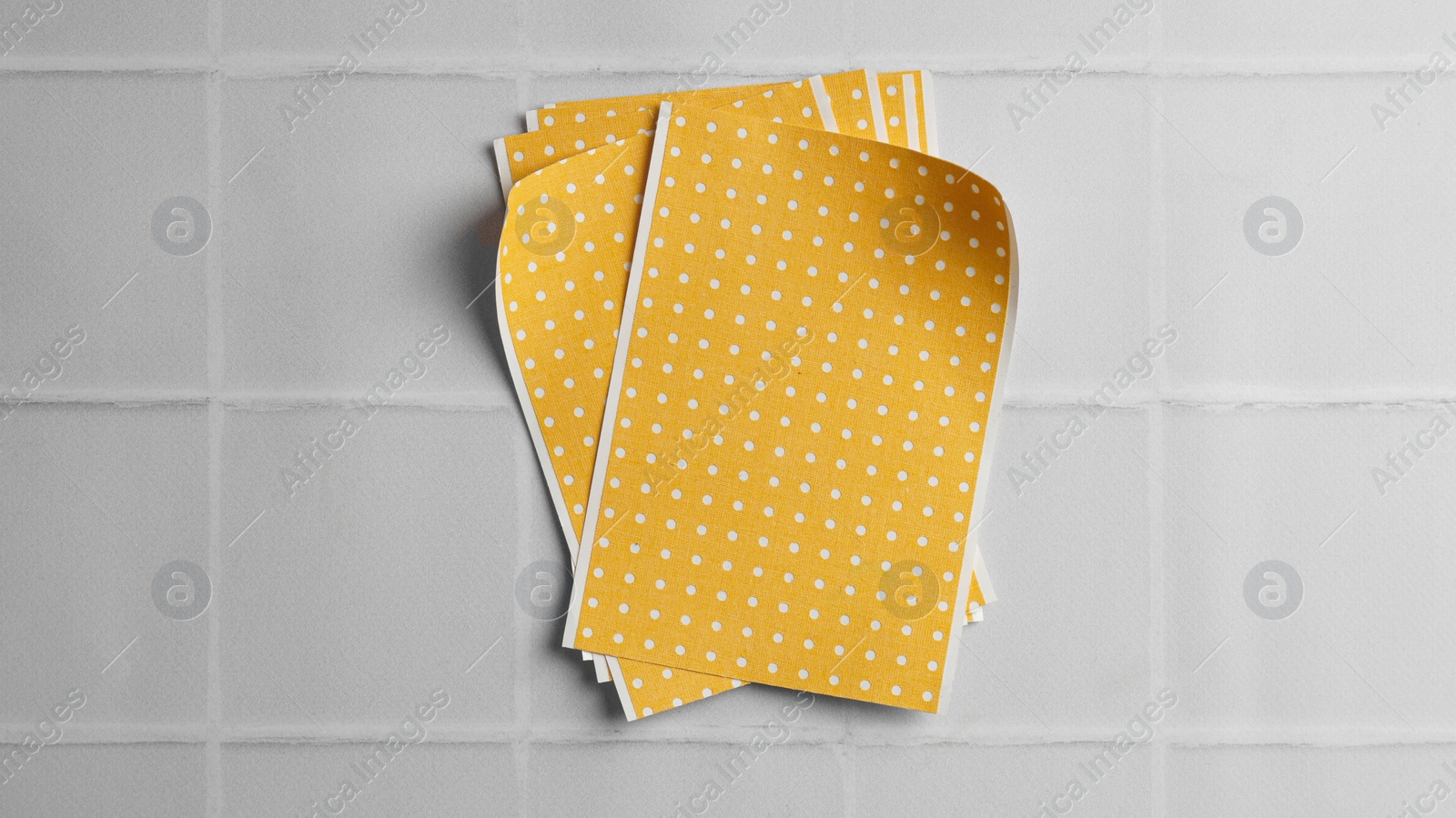 Photo of Pepper plasters on white tiled table, top view