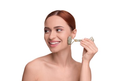 Photo of Young woman massaging her face with jade roller on white background