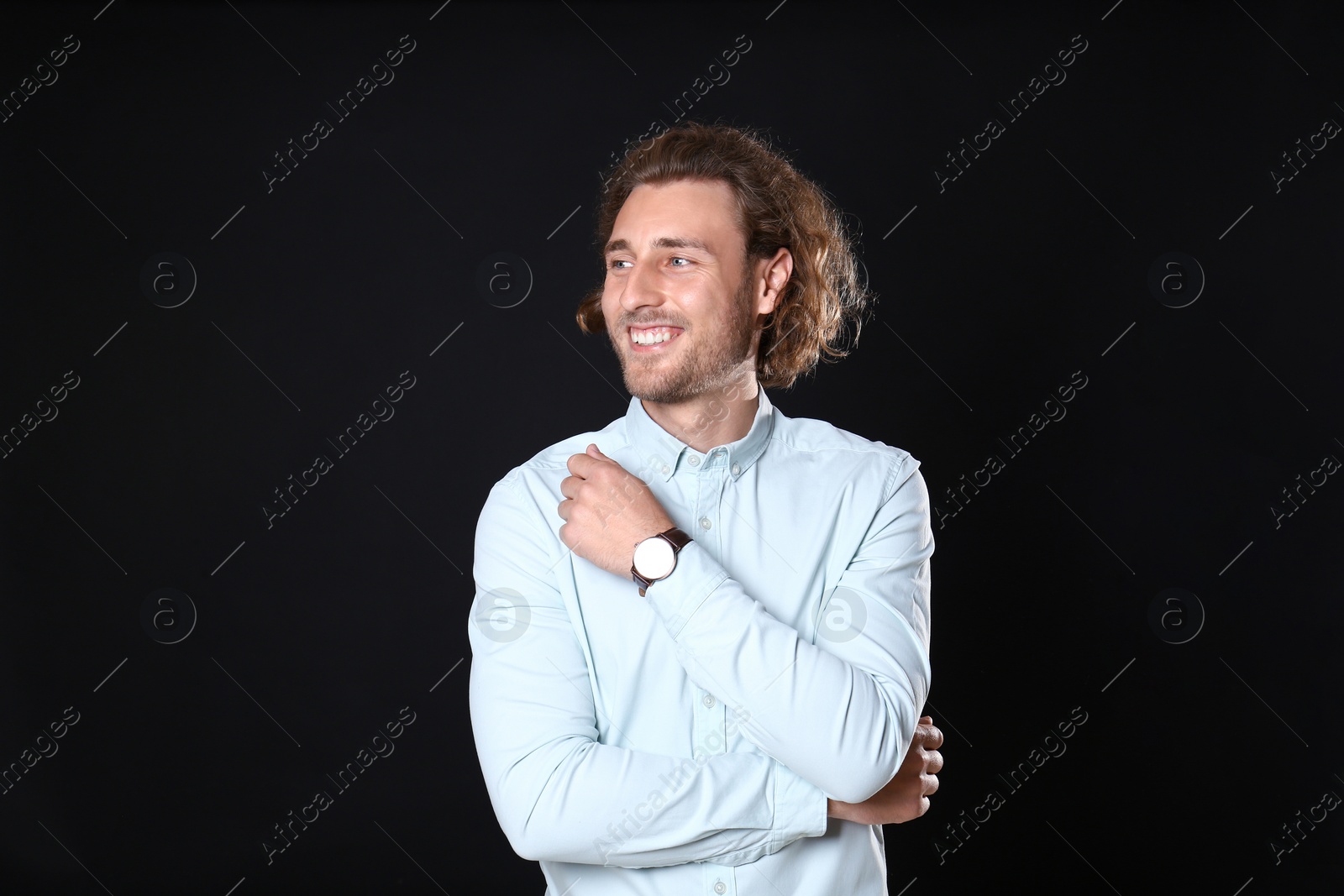 Photo of Portrait of handsome man on black background