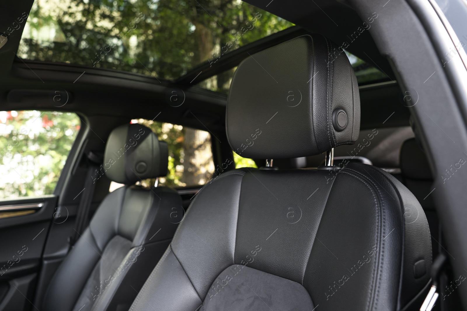 Photo of Clean leather seats inside of modern black car