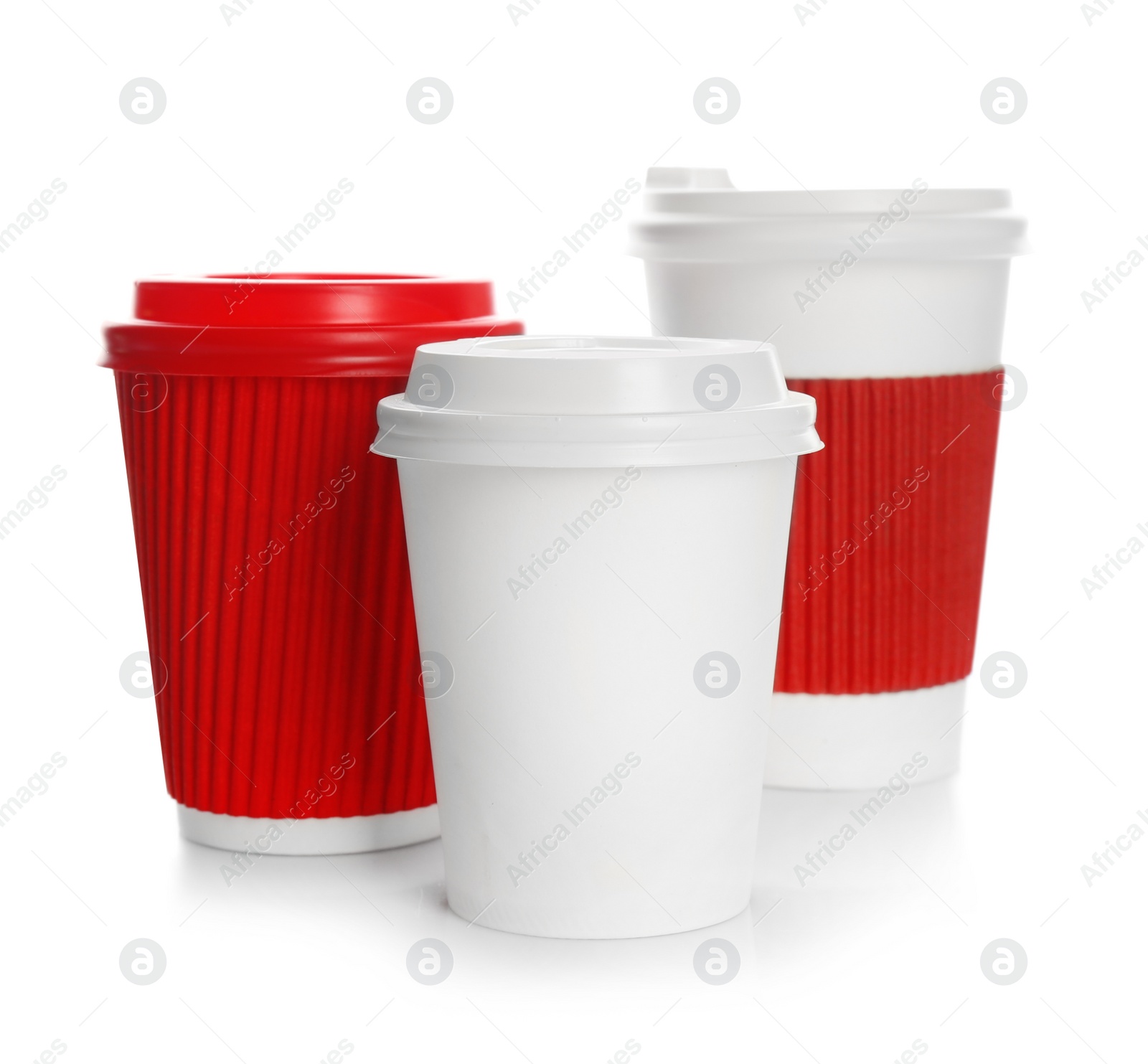 Photo of Takeaway paper coffee cups with lids on white background. Space for design