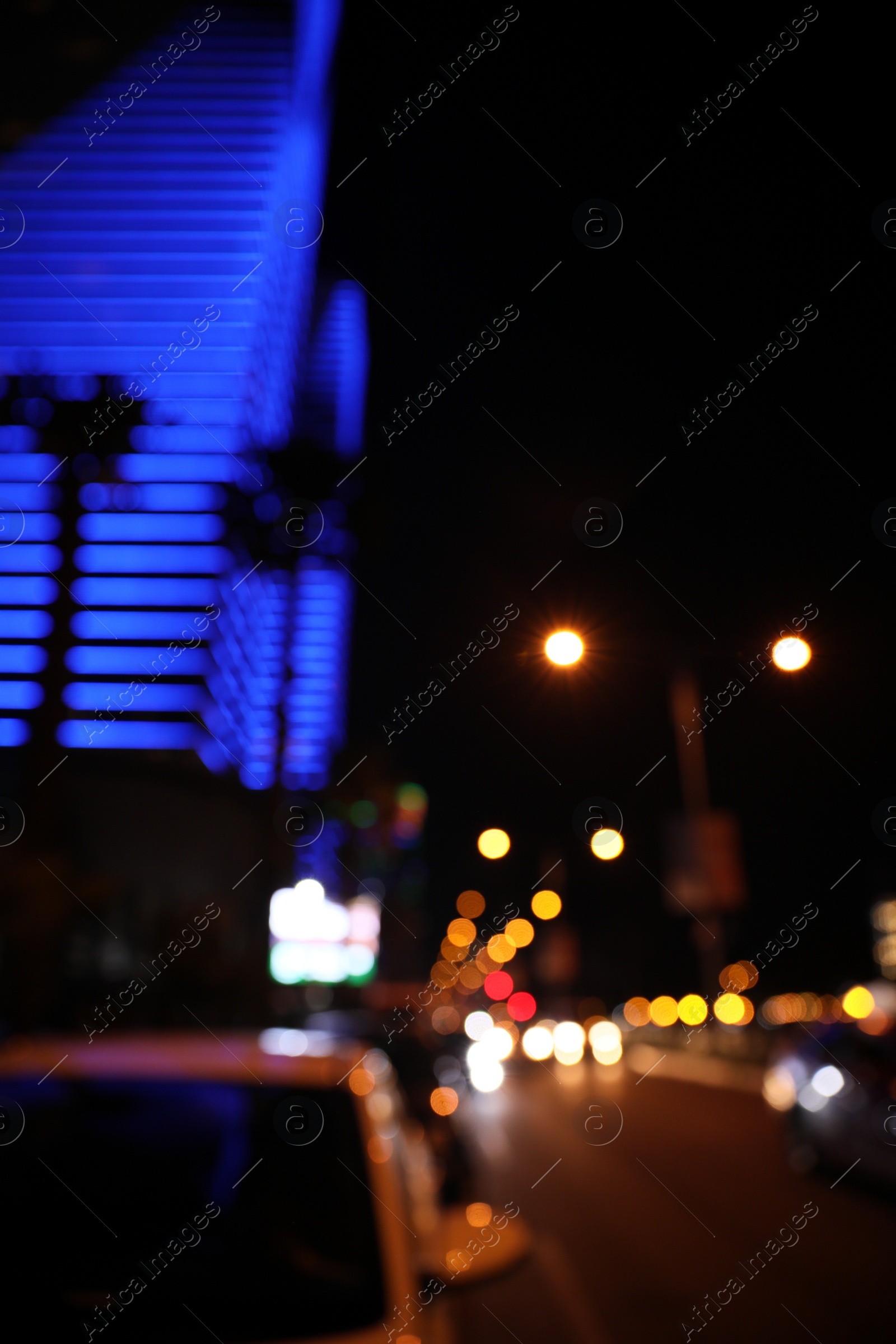 Photo of Blurred view of cityscape with bokeh effect. Night life