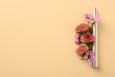 One bullet and beautiful flowers on yellow background, flat lay. Space for text