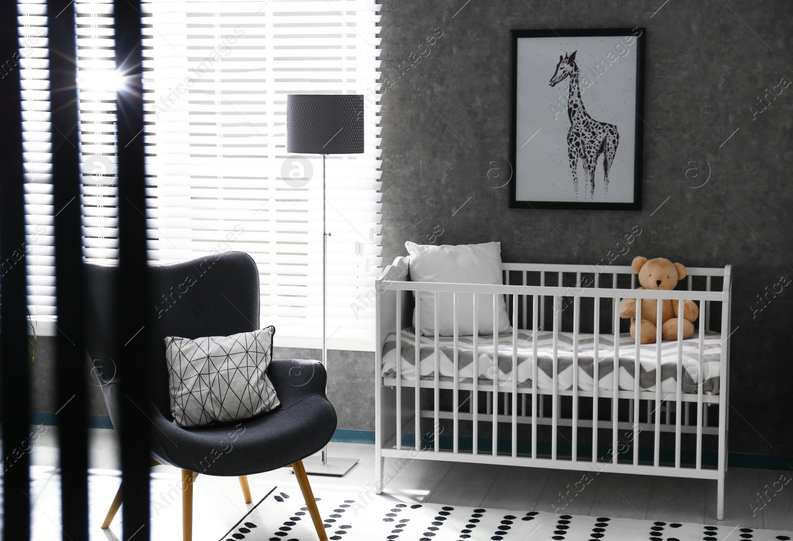 Photo of Cozy baby room interior with comfortable crib