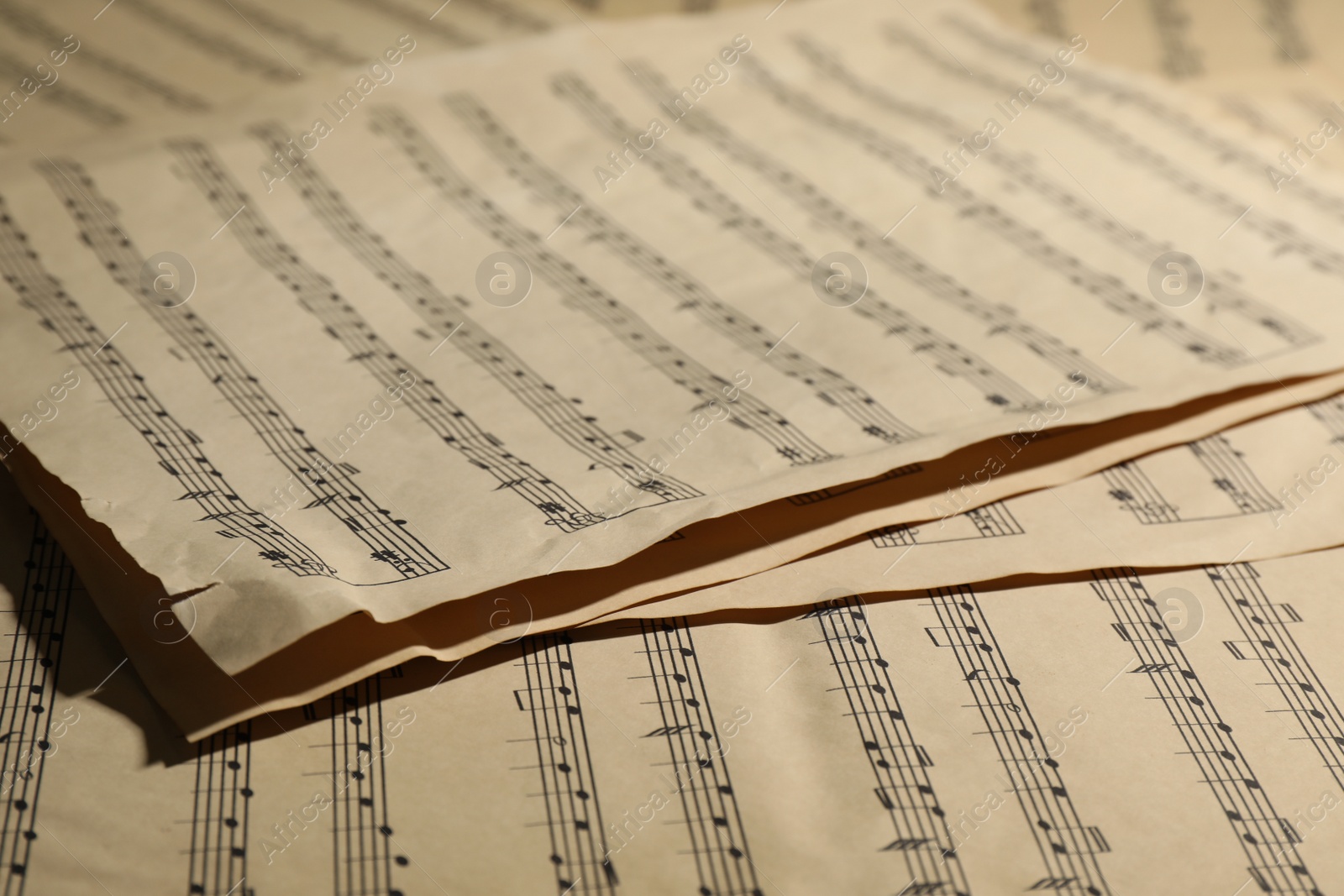 Photo of Many old note sheets as background, closeup