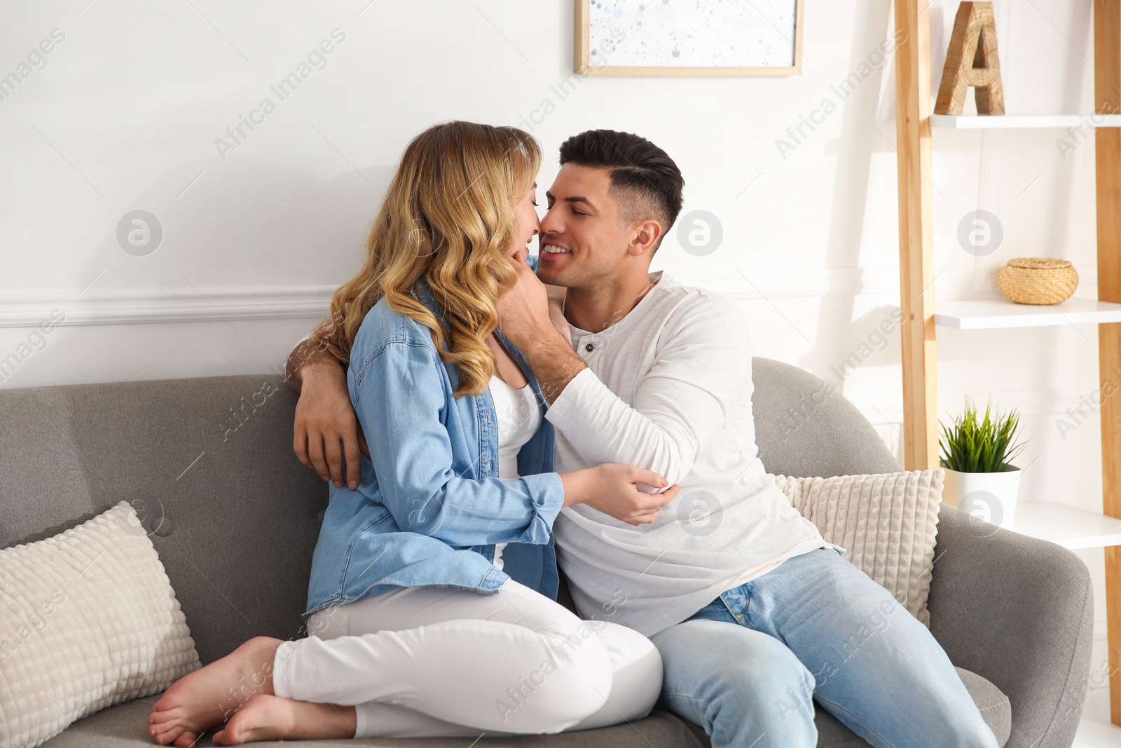 Photo of Lovely couple enjoying time together at home