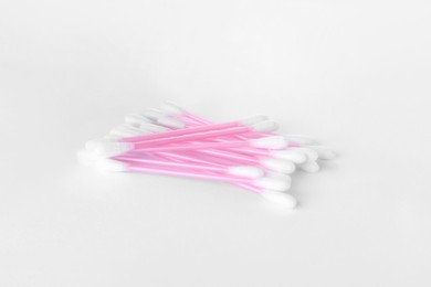 Photo of Clean cotton buds isolated on white. Hygienic product