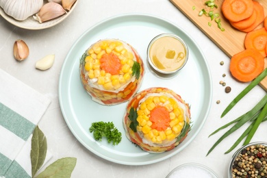 Photo of Delicious fish aspic served on light table, flat lay