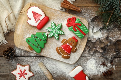 Flat lay composition with delicious homemade Christmas cookies on wooden table