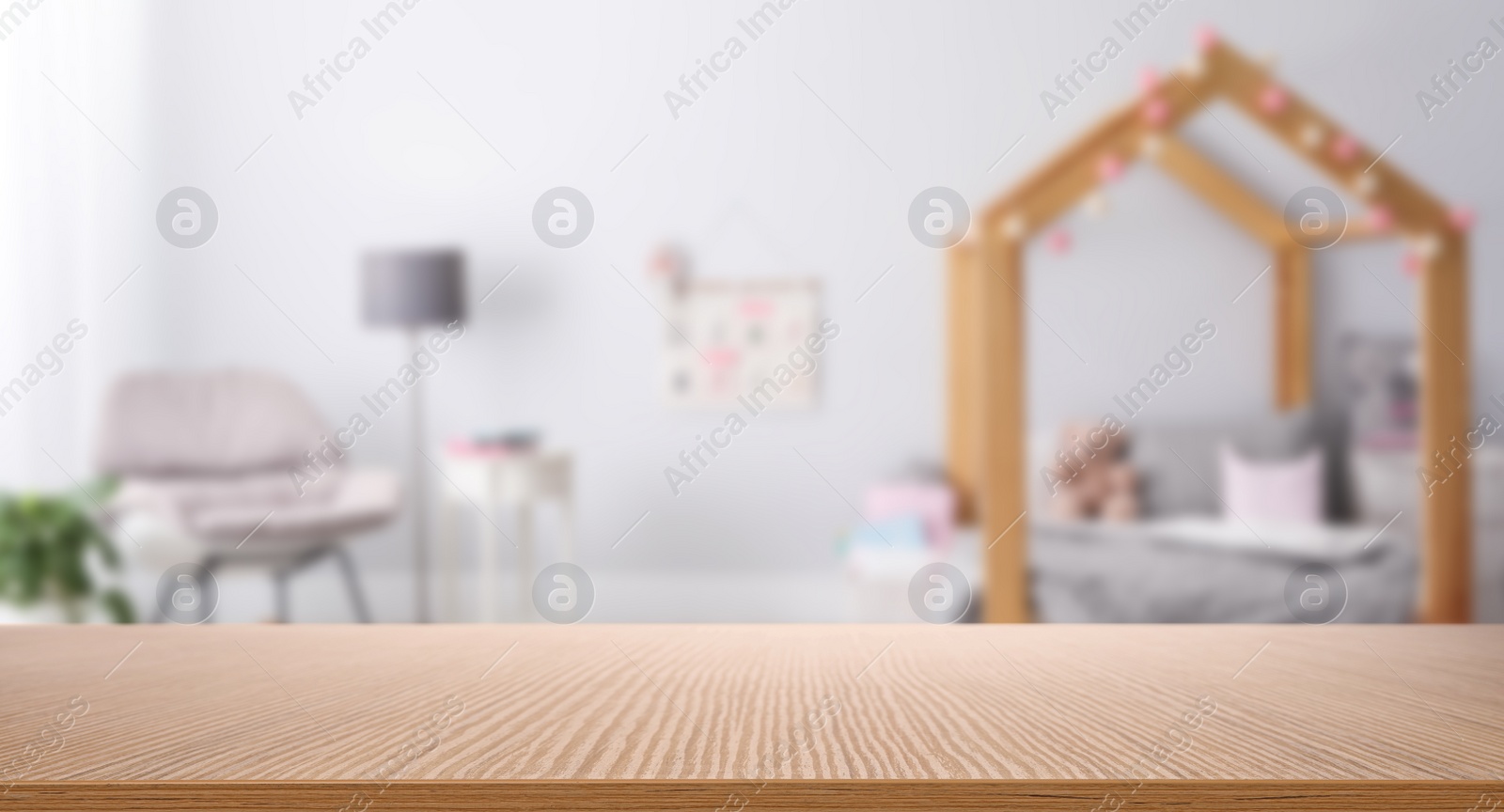 Image of Empty wooden table in baby room interior