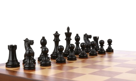 Set of black chess pieces on wooden board against white background