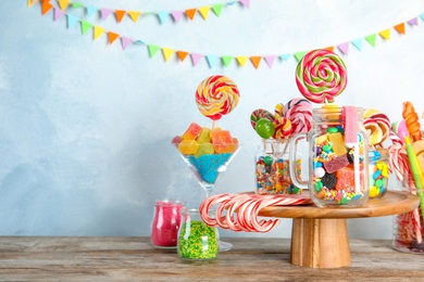 Photo of Composition with many different candies on table. Space for text