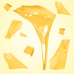 Slices of cheese falling on yellow background