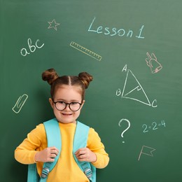 Image of School girl near green chalkboard with drawings and inscriptions