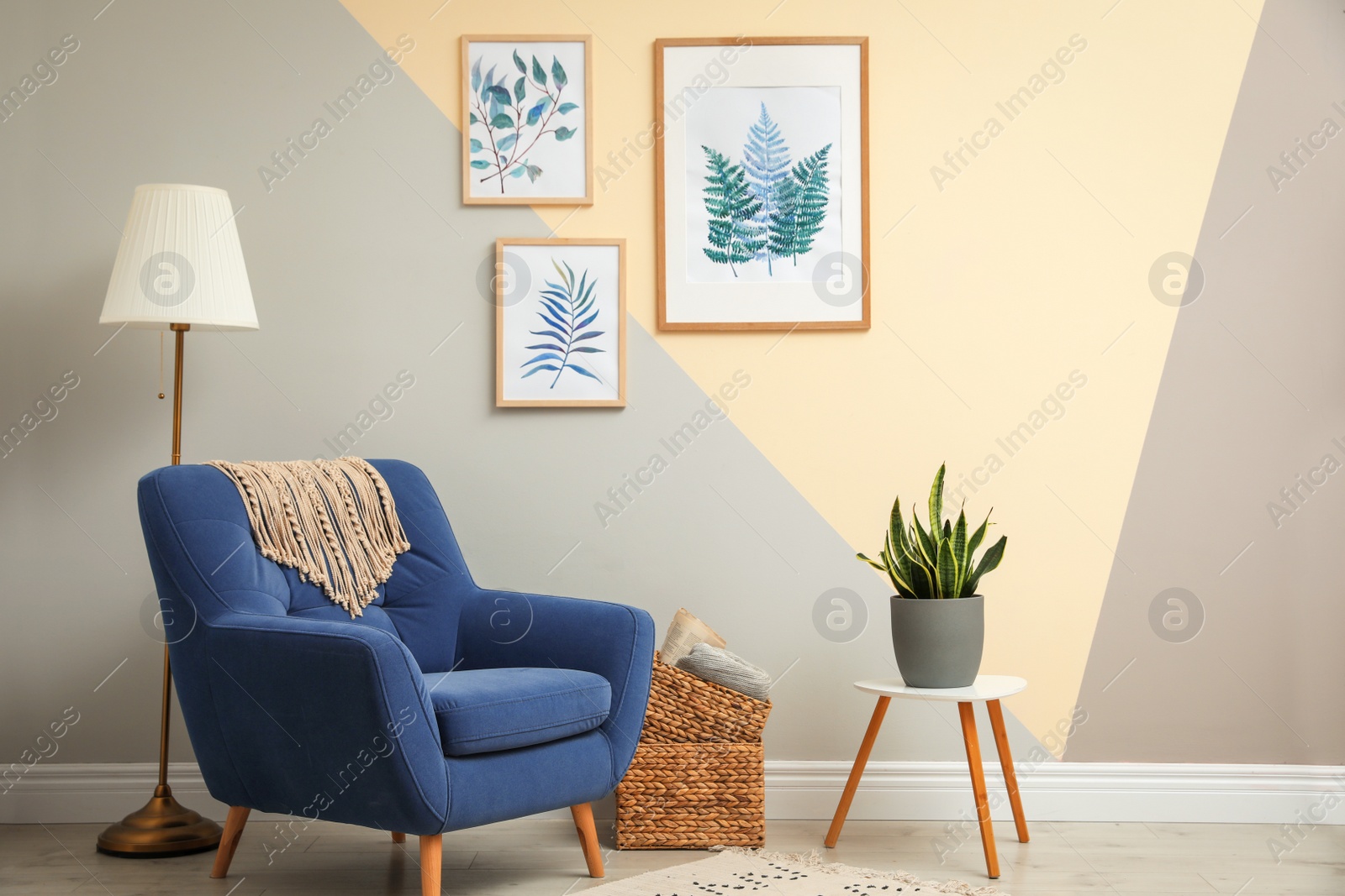 Photo of Stylish room interior design with floral paintings