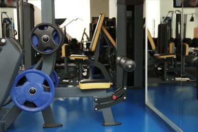 Interior of modern gym with new equipment