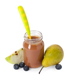 Photo of Jar with healthy baby food, blueberries, pear and slice of apple isolated on white