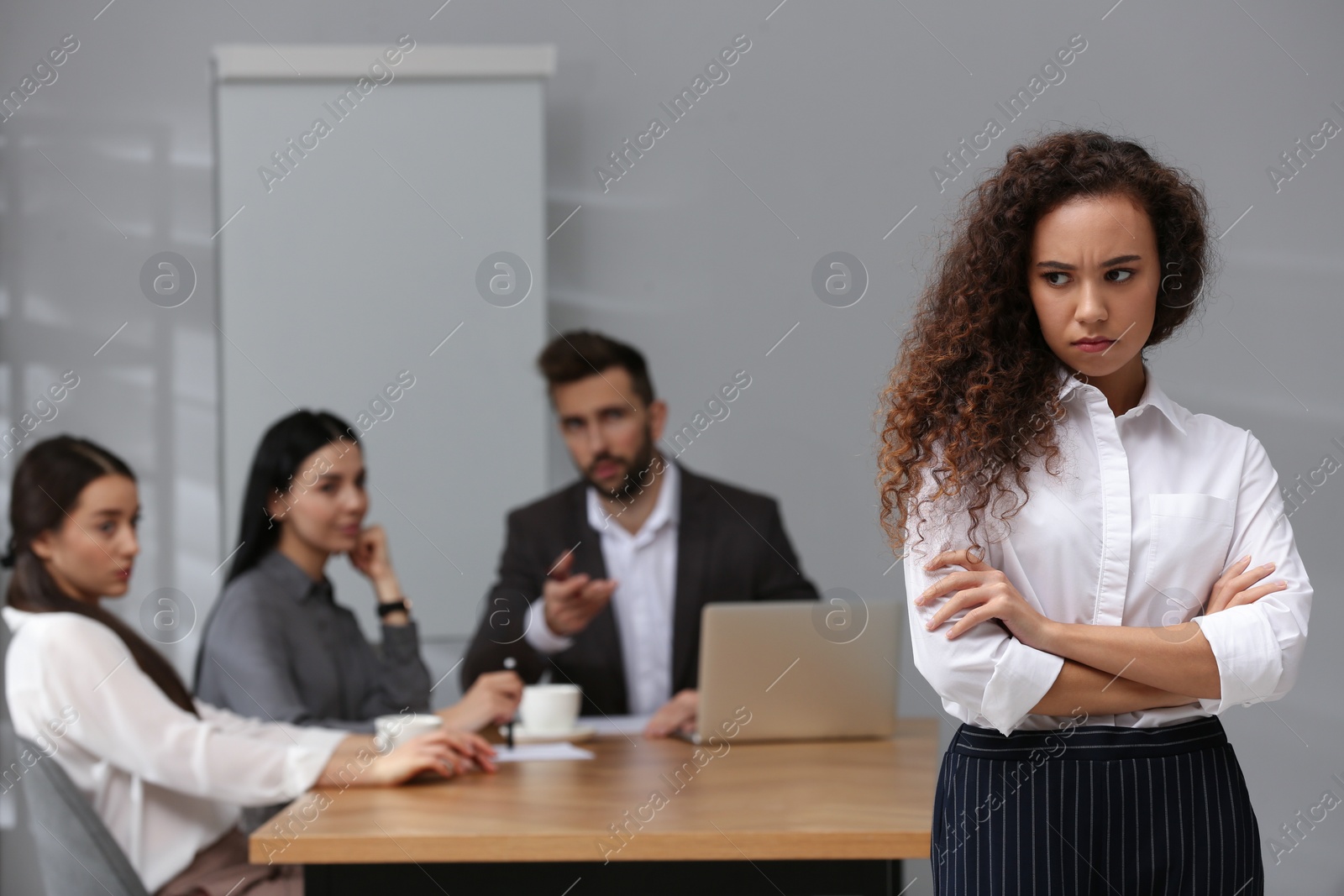 Photo of African American woman suffering from racial discrimination at work