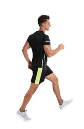 Sporty young runner walking on white background