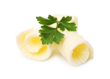 Photo of Tasty butter curls and fresh parsley isolated on white