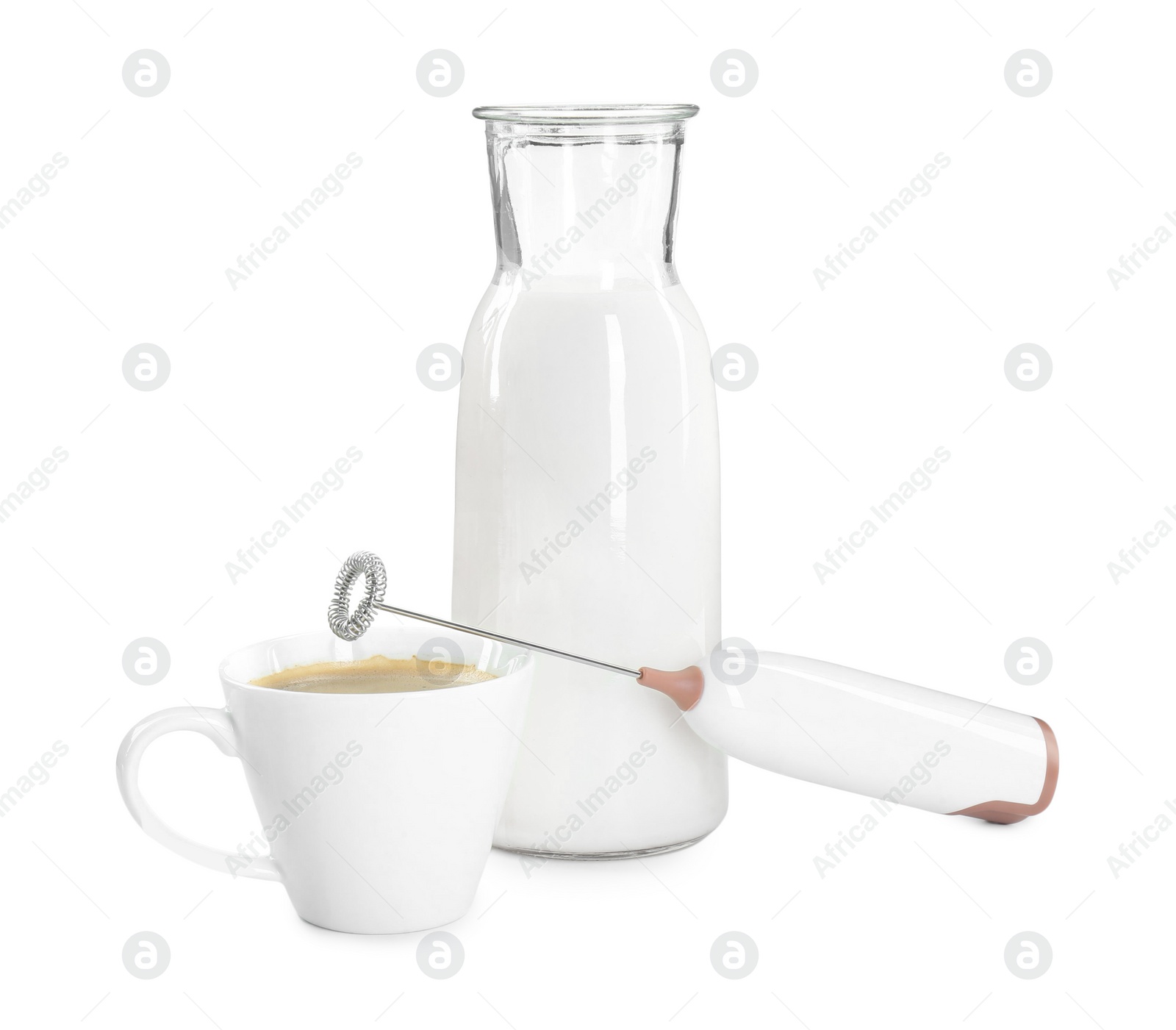 Photo of Mini mixer (milk frother), cup of coffee and bottle isolated on white