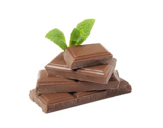 Photo of Tasty chocolate pieces and mint on white background